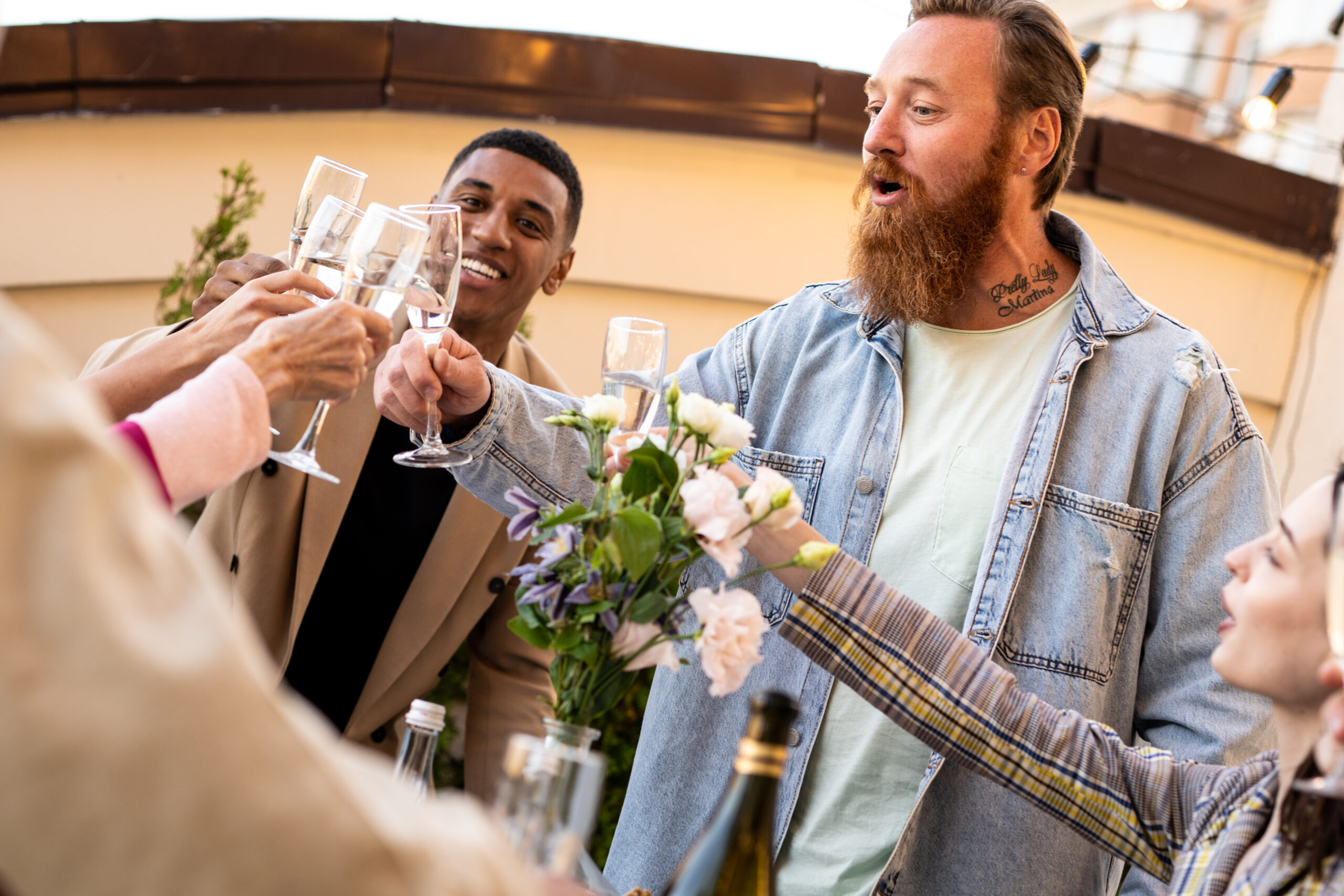 Storytelling footage of a multiethnic group of people dining on a rooftop. Family and friends make a reunion at home